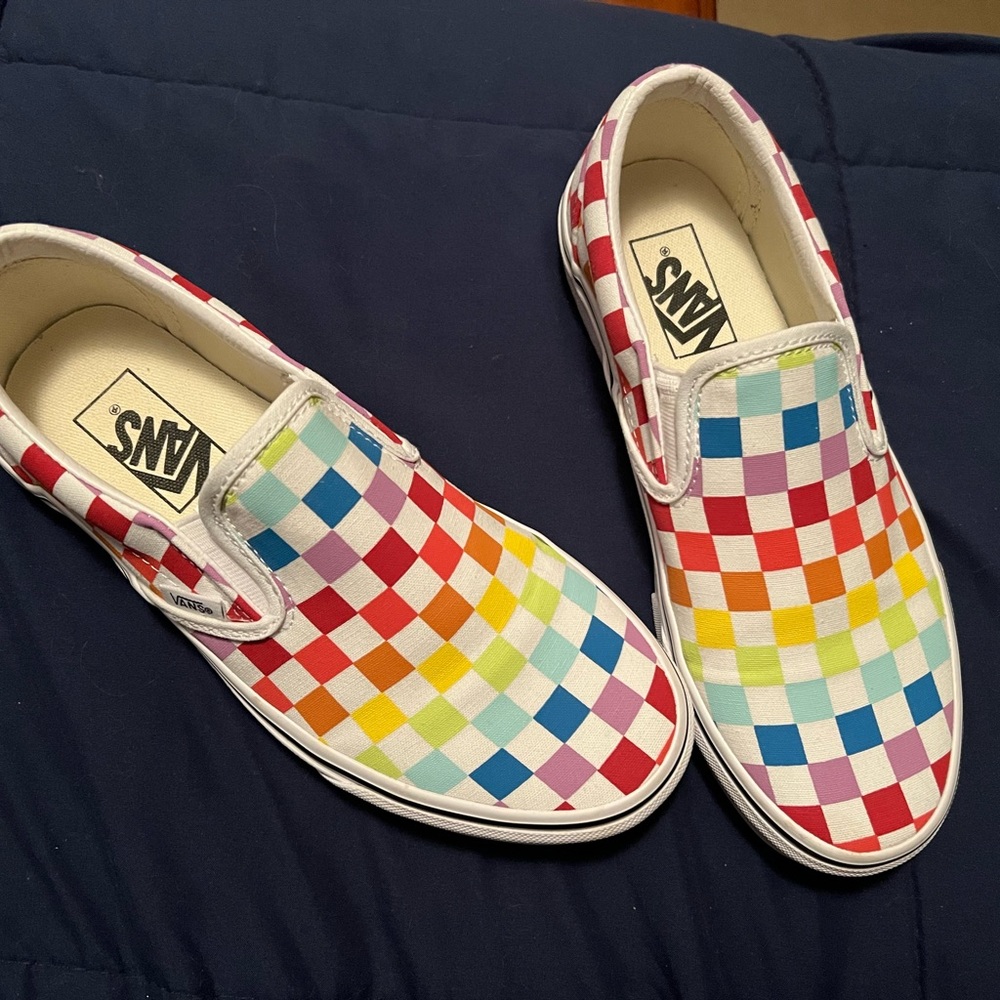 Rainbow checkered Vans slip ons